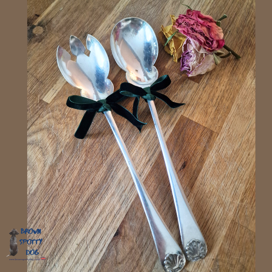 Vintage salad servers with a unique scalloped edge and shell pattern Handle