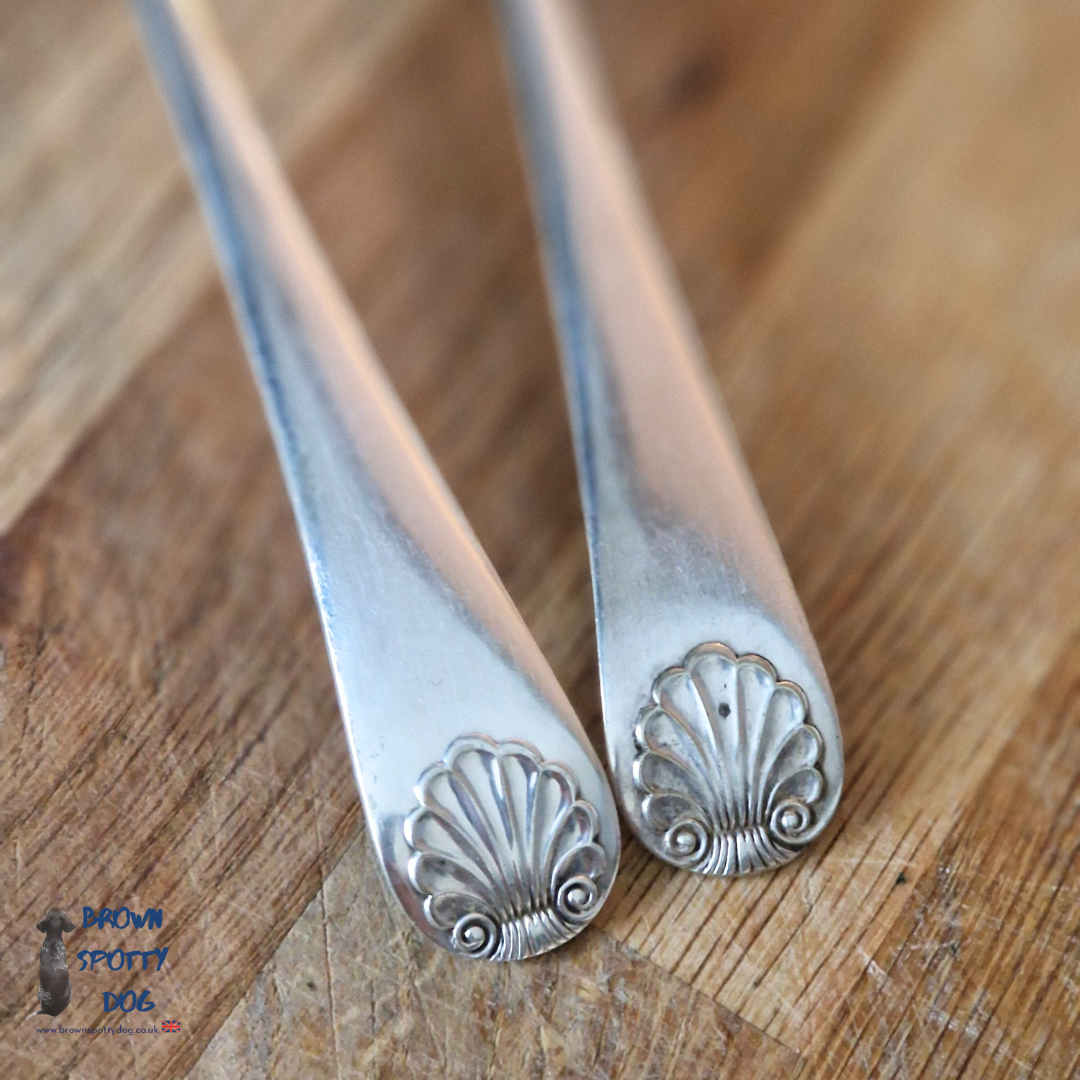 Vintage salad servers with a unique scalloped edge and shell pattern Handle